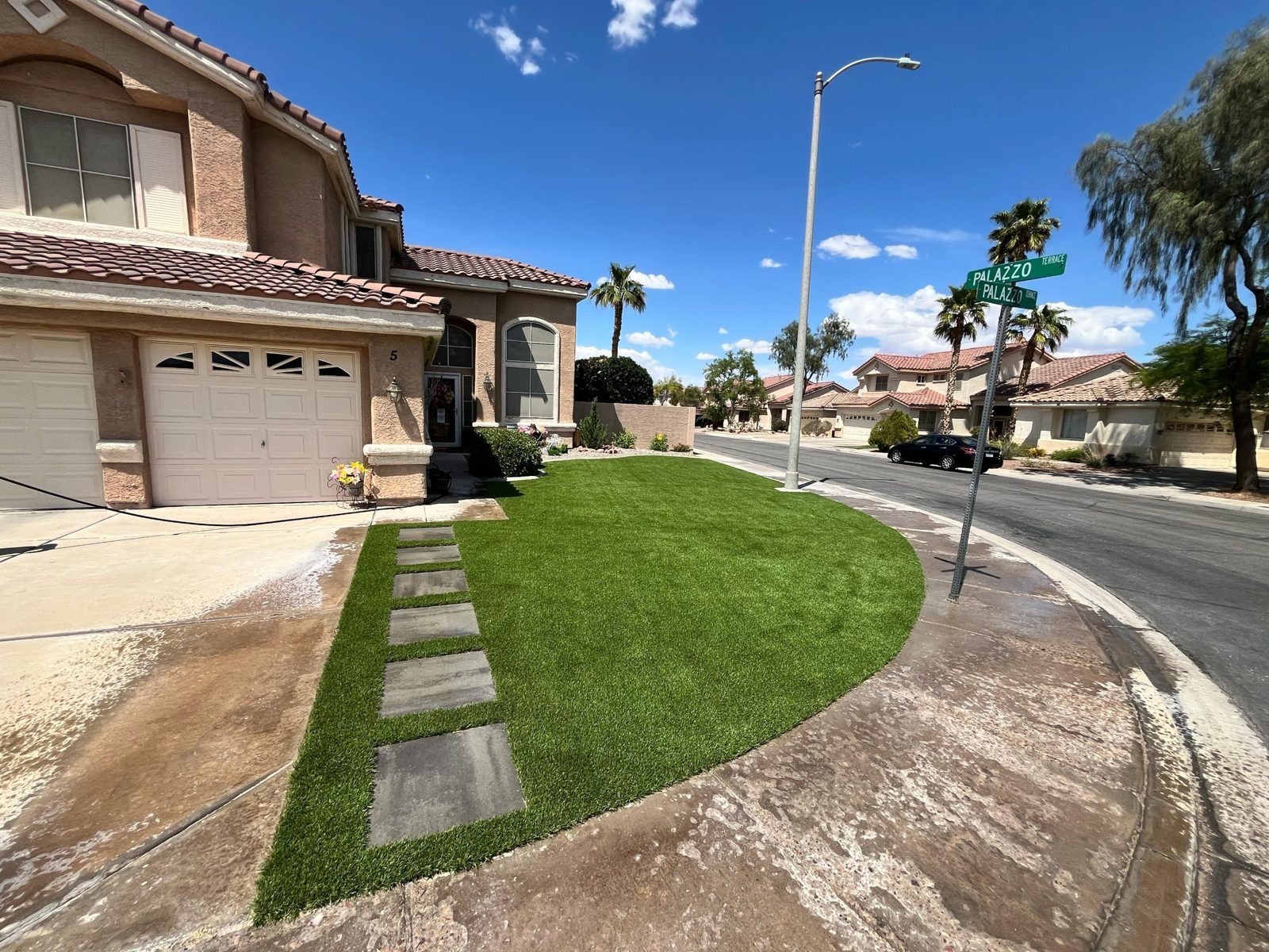 Artificial turf front yard with stepping pavers in Henderson, NV