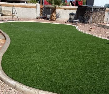 Backyard artificial turf with pavers